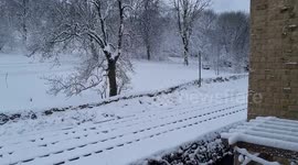 Train rides on a snow-covered railway in Haworth, UK