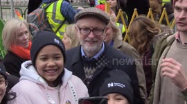 File: Former Labour leader Jeremy Corbyn takes photos with fans at NHS rally in London