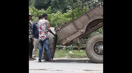 Tractor wheel Loading on Tractor By Man Power at road in Odisha