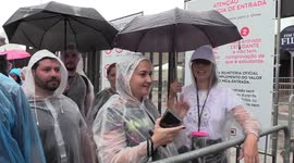 Coldplay fans line up for gig despite delays and heavy rain in Sao Paulo, Brazil