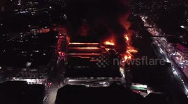 Aerial footage shows huge fire ripping through market in the Philippines