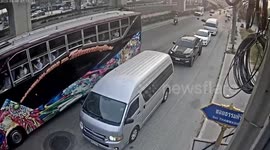 Motorcycle riders crash when they hit oil slick on road in Thailand