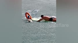 Heroic Chinese men break through ice to rescue dog trapped in frozen lake