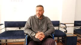 Palestinian Muwaiya Al-Wahidi 43, with amputated leg, works at barber shop on the Palestinian Wounded's Day, in Gaza city