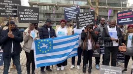 Southern Cameroons potesters outside Westminster Abbey during Commonwealth Day Service