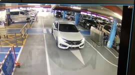 Hot-headed driver turns herself in after slapping airport car park attendant