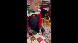 *Wholesome Christmas Surprise* Happiness erupts all around when boy opens his Christmas present