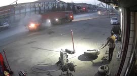 Quick-thinking garage owner helps extinguish fire on passing truck in China