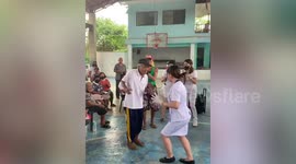Kind volunteer nurses dance with elderly after medical mission