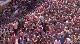 Coaches shoot coloured powder into crowds of thousands as Indore celebrates Hindu festival