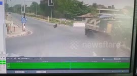 Pickup truck carrying fuel tanks overturns in collision with 18-wheeler at intersection