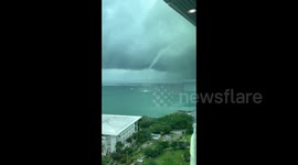 Waterspout seen swirling close to boat in Australia's Darwin Harbour