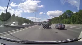 WTF Moment: Tire Drops From The Back of a Truck Nearly Hitting Multiple Vehicles