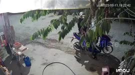 Brave female shopkeeper fights off phone snatchers and takes their scooter