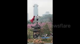 Tourist's drone smacks performer in the face during high-altitude show at scenic spot in China