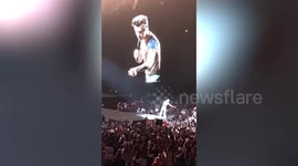 Harry Styles duets with fan to help with marriage proposal during his concert