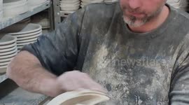 Palestinians make crescents from the ceramics ahead the Muslim holy month of Ramadan at a ceramic dustry, in the Old City in West Bank city of Hebron