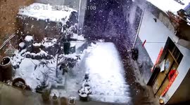 Avalanche of snow crashes of building's roof in central China