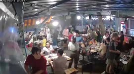 Diners flee as storm blows through outdoor restaurant in Thailand