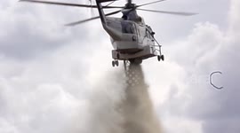 Water Helicopter Fighting A Fire From The Air Making A Water Drop On The Fire