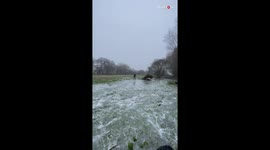 Girl HILARIOUSLY slips and falls while walking over frozen lake