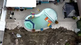 Drone footage shows California homes teetering on edge of cliff after landslide