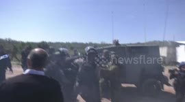 Palestinian protesters argue with Israeli forces during a protest against the expansion of Jewish settlements, in al-Laban al-Gharbi village near the West Bank city of Ramallah