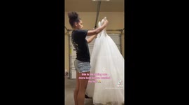 Prom-goer spends $45 on wedding dress and turns it pink during DIY project