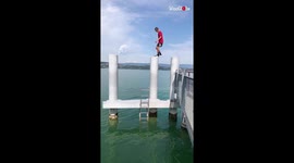 Parkour fanatic follows a CRAZY pillar jump by side flipping into water
