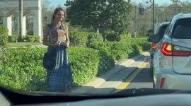 A young lady holds a sign hoping to get help to buy food!!!
