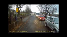 Impatient motorist drives up the pavement at Ribblesdale school in Clitheroe as School children leave school