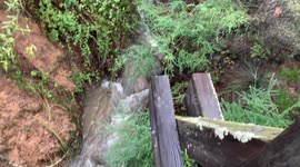 recent atmospheric river in California triggers a creek bed collapse