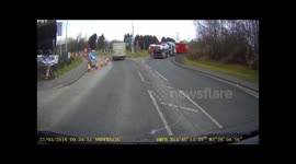 Dangerous Careless Car transporter tries to go the wrong way round a roundabout