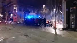 Marseille police shield themselves from fireworks, stones, and bottles during pension reform protest