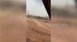 Terrifying dust devil tornado blows away bamboo hut in Laos