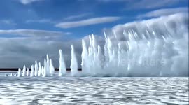 Water propels into air as Chinese workers blow up frozen river to prevent build up of ice