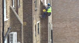 Workmen in process of doing height jobs in Londons Earls Court