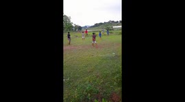 Village Football Match  . Indian Village boys playing football  in the green field