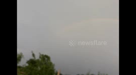 beautiful natural rainbow in the sky  Beautiful rainbow on a cloudy sky after rain