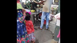 Indian Man Selling Sugarcane Juice on road side  Street Drink frees Sugarcane Juice