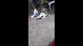 Shoes Polish on street in India  Indian Man cleaning and polishing shoes in the road side
