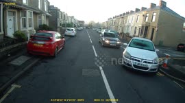 Driver fails to clear windows of frost and ice and nearly crashes with a Taxi