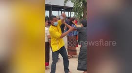 Proud father excitedly takes video of son dancing at show