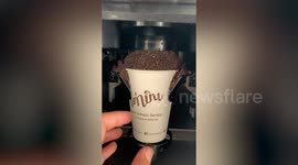 Automated 'robot barista' gives generous chocolate toppings to delighted students