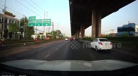 Screw smashes car windscreen while driving on Thai highway