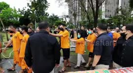 Indonesian police use road roller to flatten 1,000s of ceased alcoholic drinks