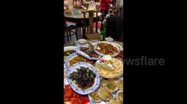 Shocking moment DEAD RAT falls from ceiling onto diner's plate at Chinese restaurant