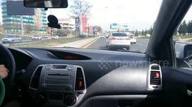 Close Call: Speeding White Car Comes Extremely Close to Hitting Another Vehicle in Traffic