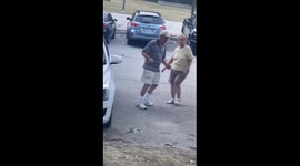 Older couple sharing a dance at a local park that had a live band playing