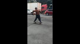 Talented boy shows off impressive basketball dribbling whilst balancing on skateboard
